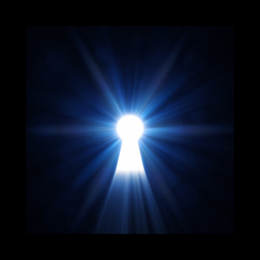 a keyhole with light glowing through it