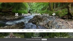 A blog homepage for Fingle Woods featuring a forest stream, navigation menu, and logos for the Woodland Trust and National Trust.