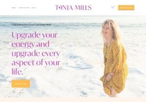 A woman in a yellow dress stands on a beach near the water, smiling. Text reads, "Upgrade your energy and upgrade every aspect of your life.