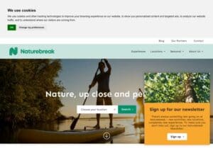 A website homepage for Naturebreak shows people paddleboarding on a lake, a cookie consent banner at the top, and a newsletter sign-up pop-up in the lower right.